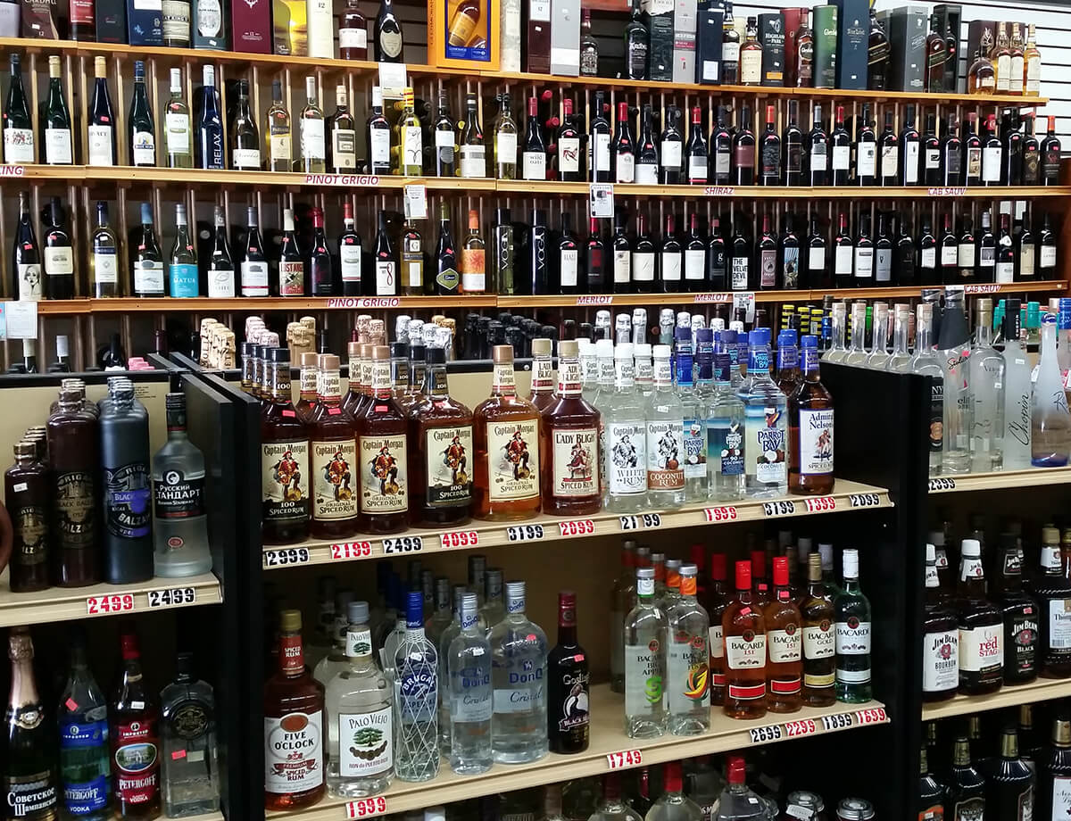 Store display showing various liqueurs and wines available